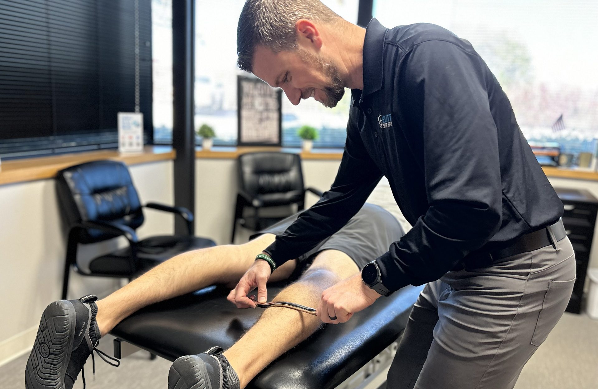 Dr. Shiels working on a patient Achillies tendon