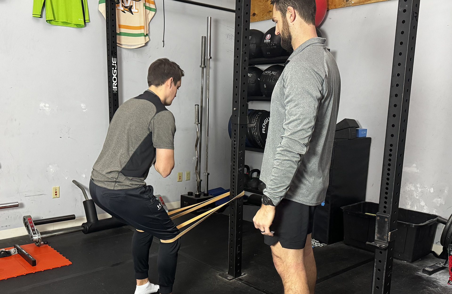 Tyler Koehler observing a client stretching