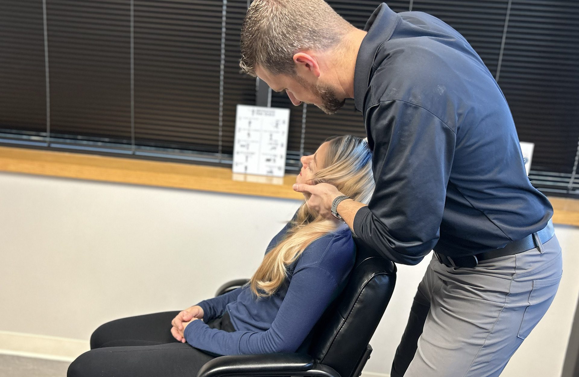 Dr. Zach Shiels performing a technique on clients neck