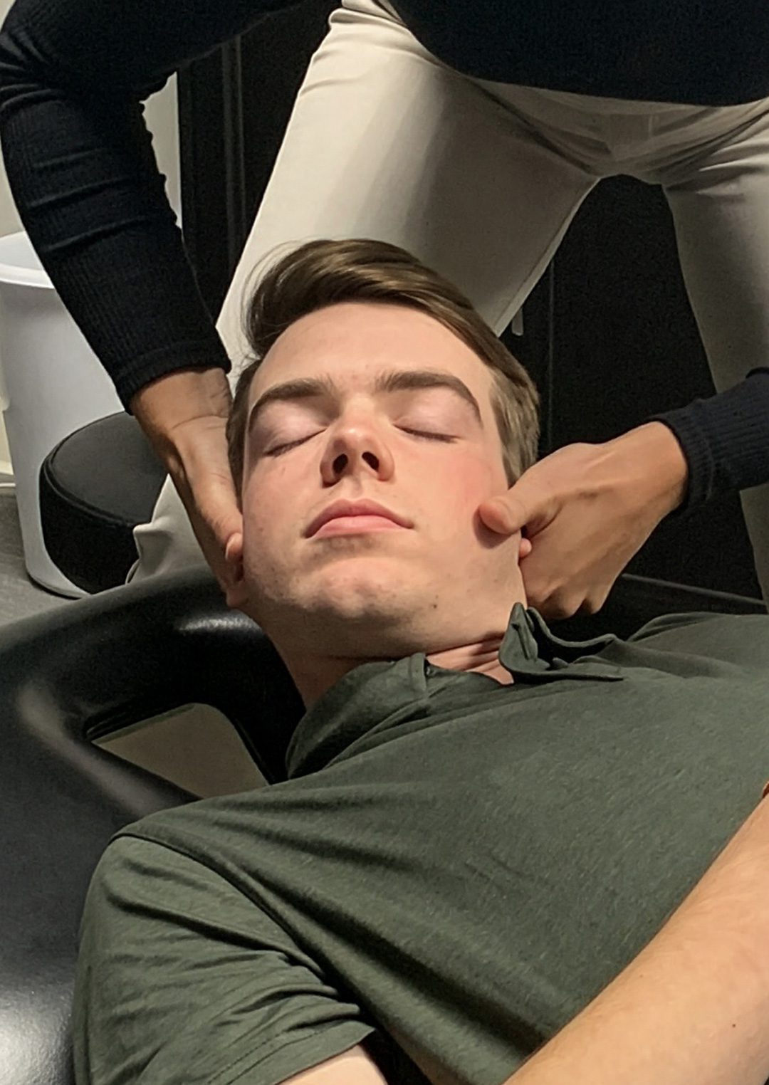 Chiropractor performing a neck relief technique